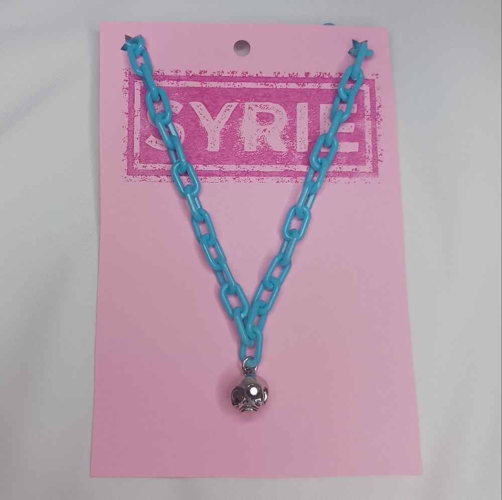 Plastic Bright Blue Link Necklace with Silver Skull with Rhinestone Eyes.